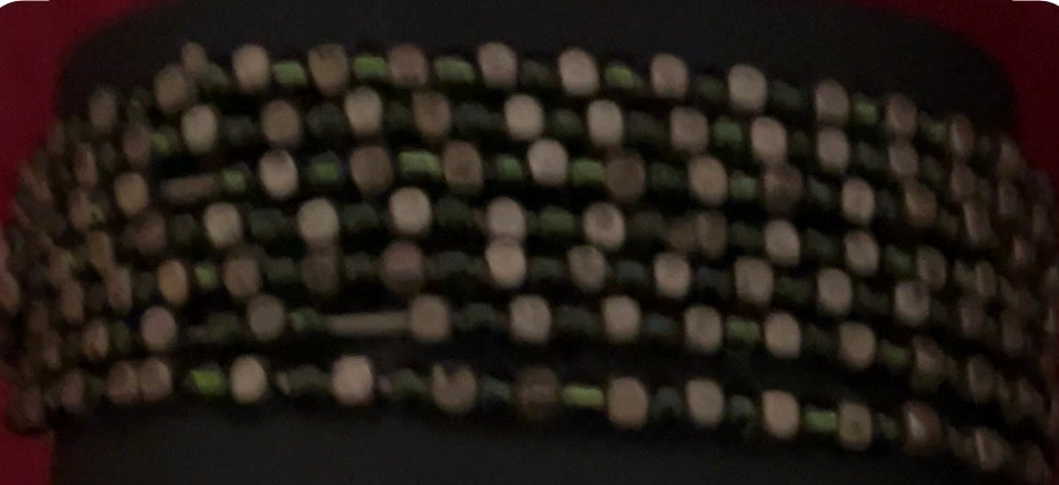 Wide multi-strand beaded stretch cuff bracelet. It