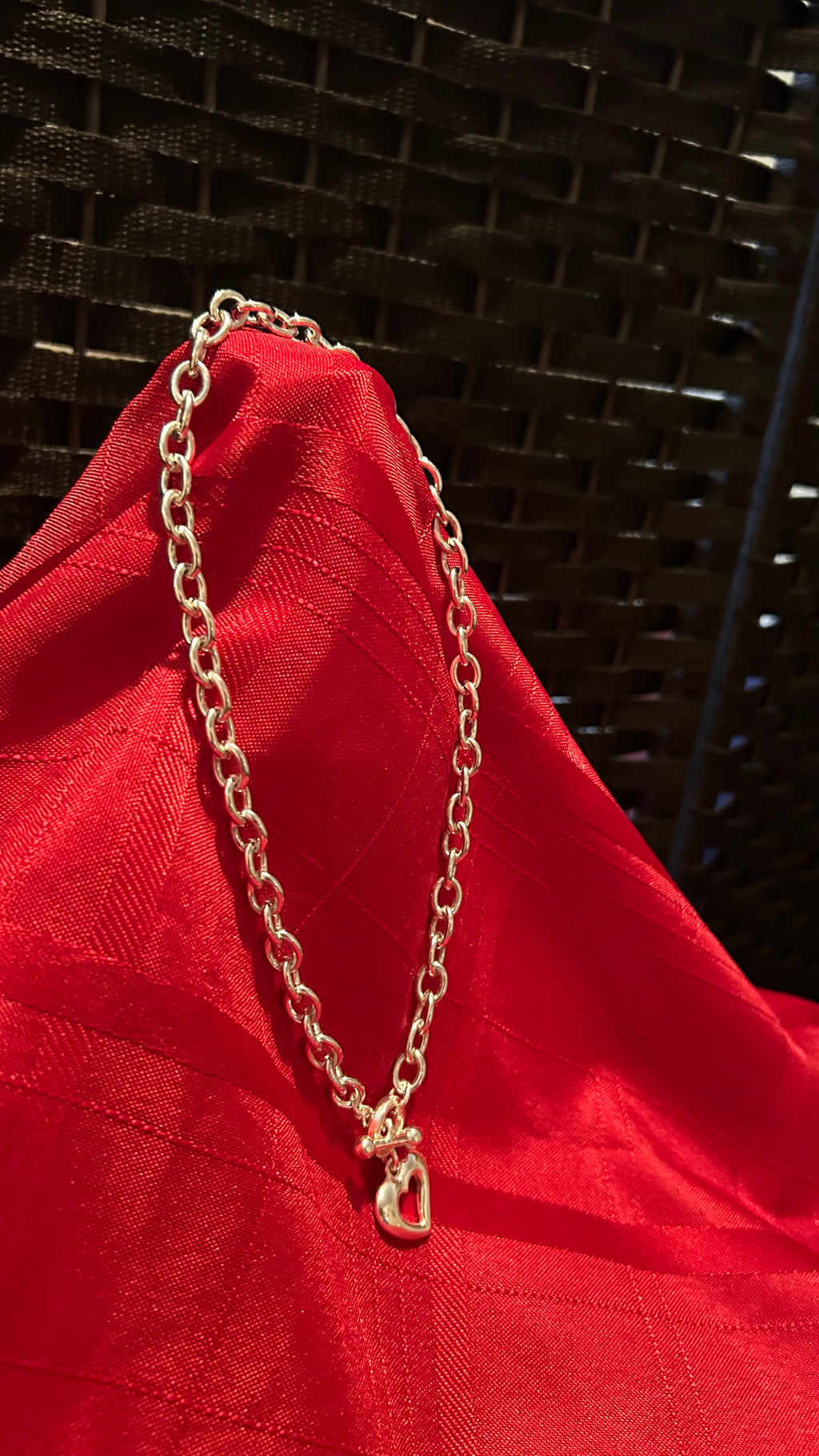 Silver-tone chunky link chain necklace featuring a heart-shaped pendant
