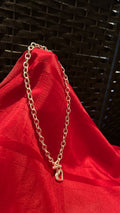 Silver-tone chunky link chain necklace featuring a heart-shaped pendant