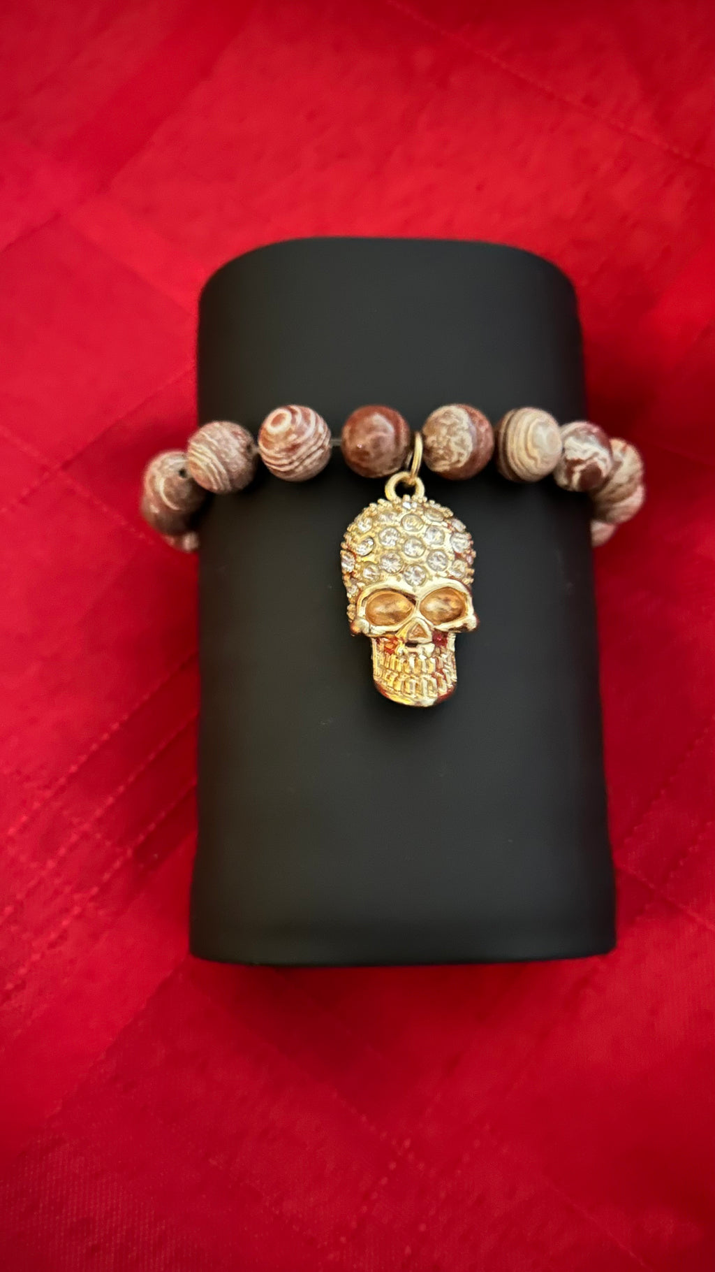 Picture Jasper beads and a central skull charm.