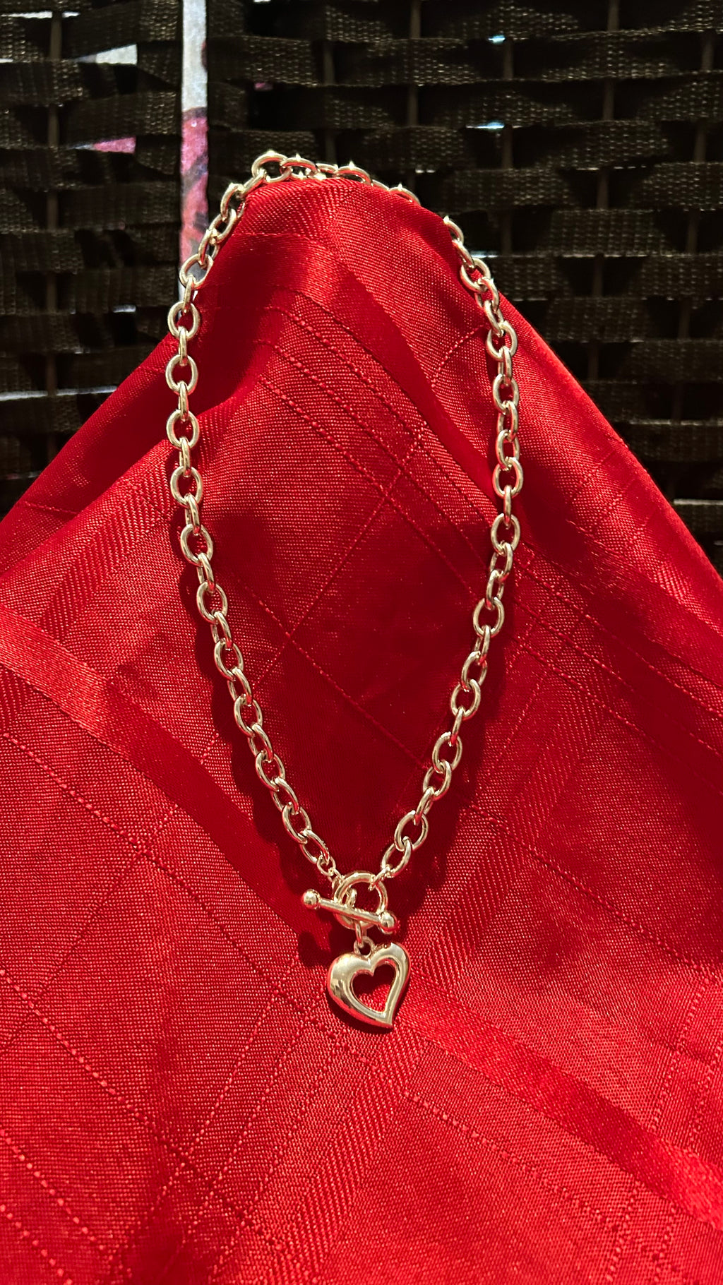 Silver-tone chunky link chain necklace featuring a heart-shaped pendant