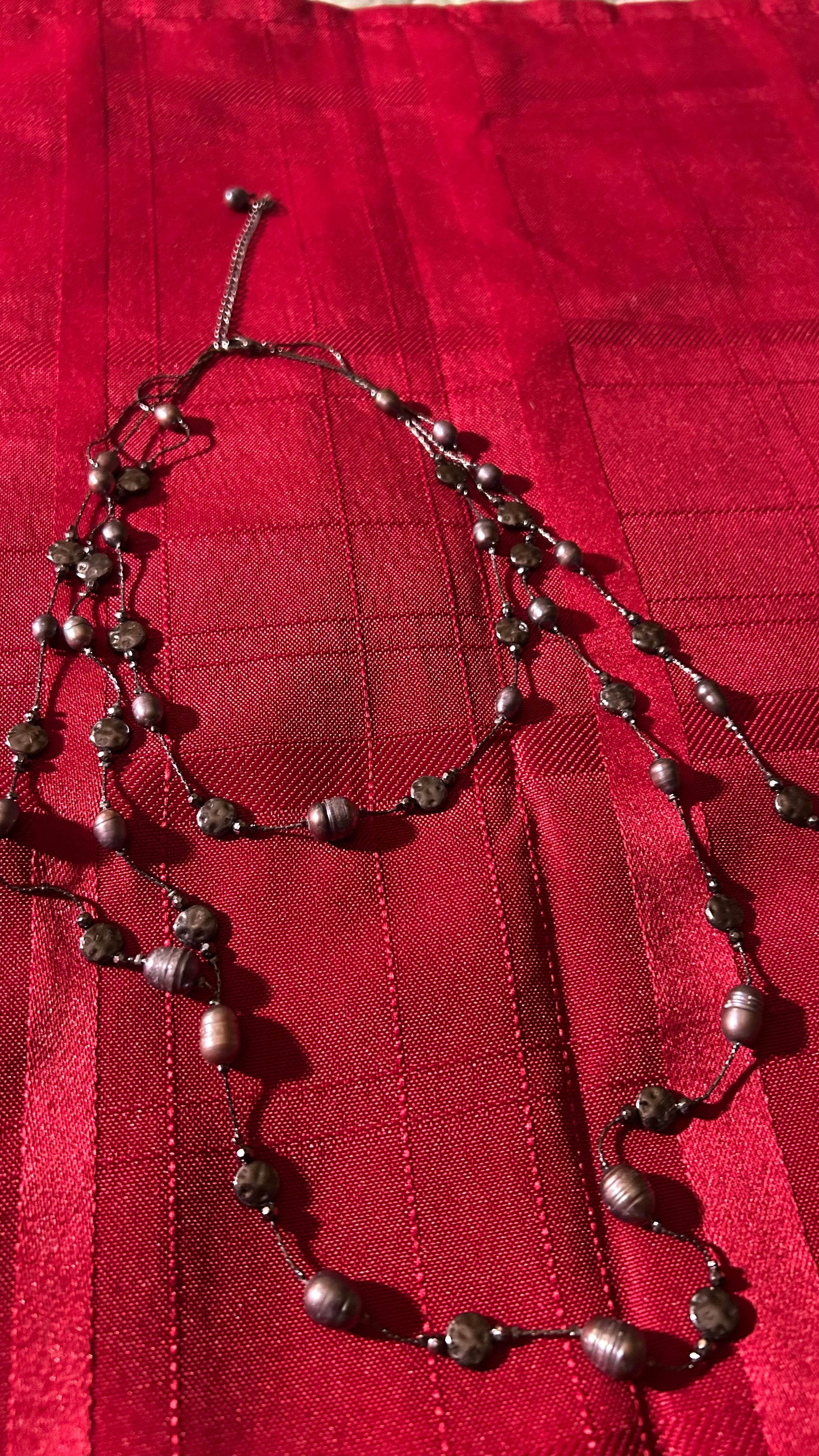 Long double-strand beaded necklace