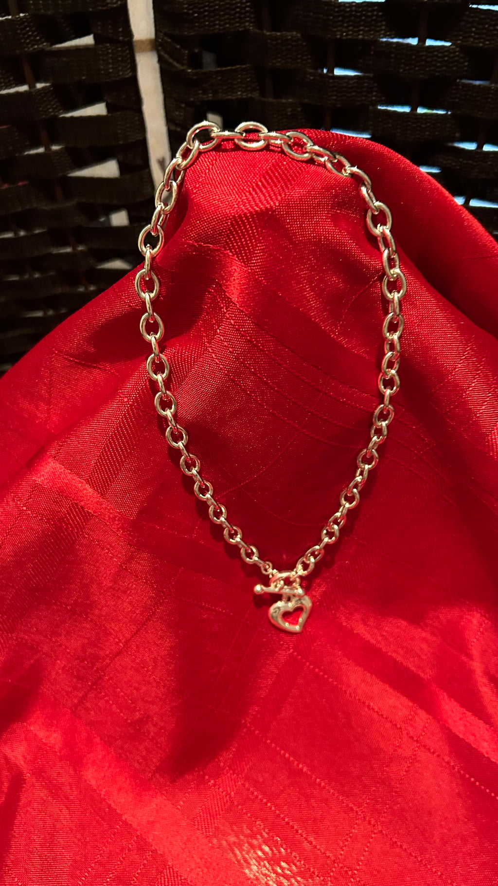 Silver-tone chunky link chain necklace featuring a heart-shaped pendant