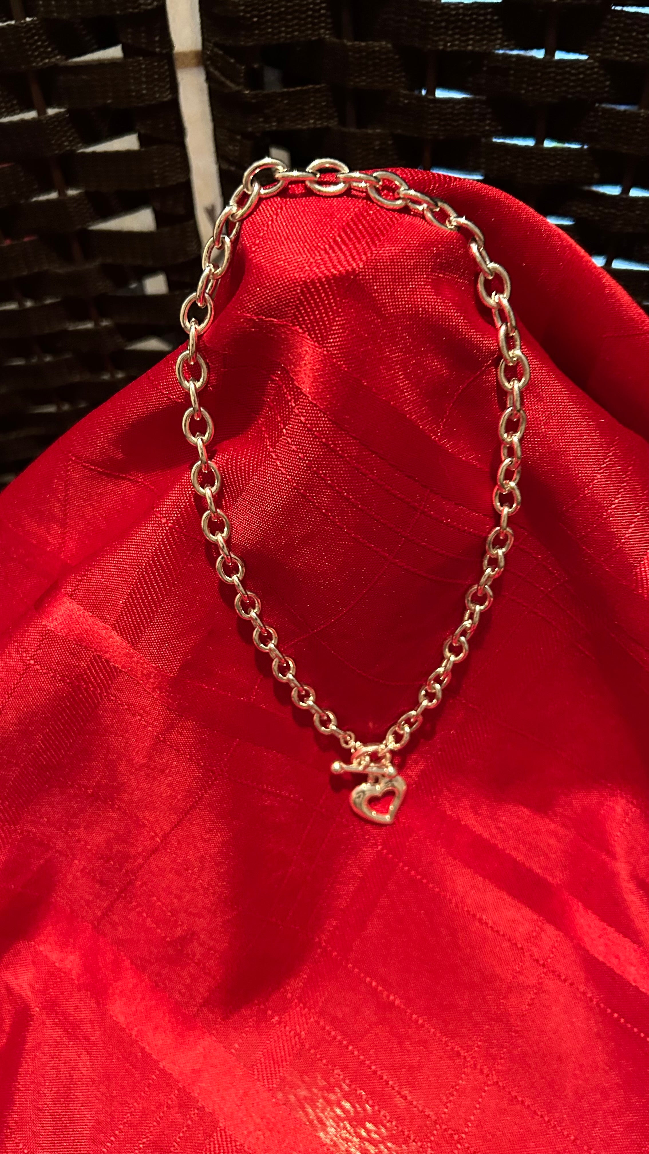 Silver-tone chunky link chain necklace featuring a heart-shaped pendant