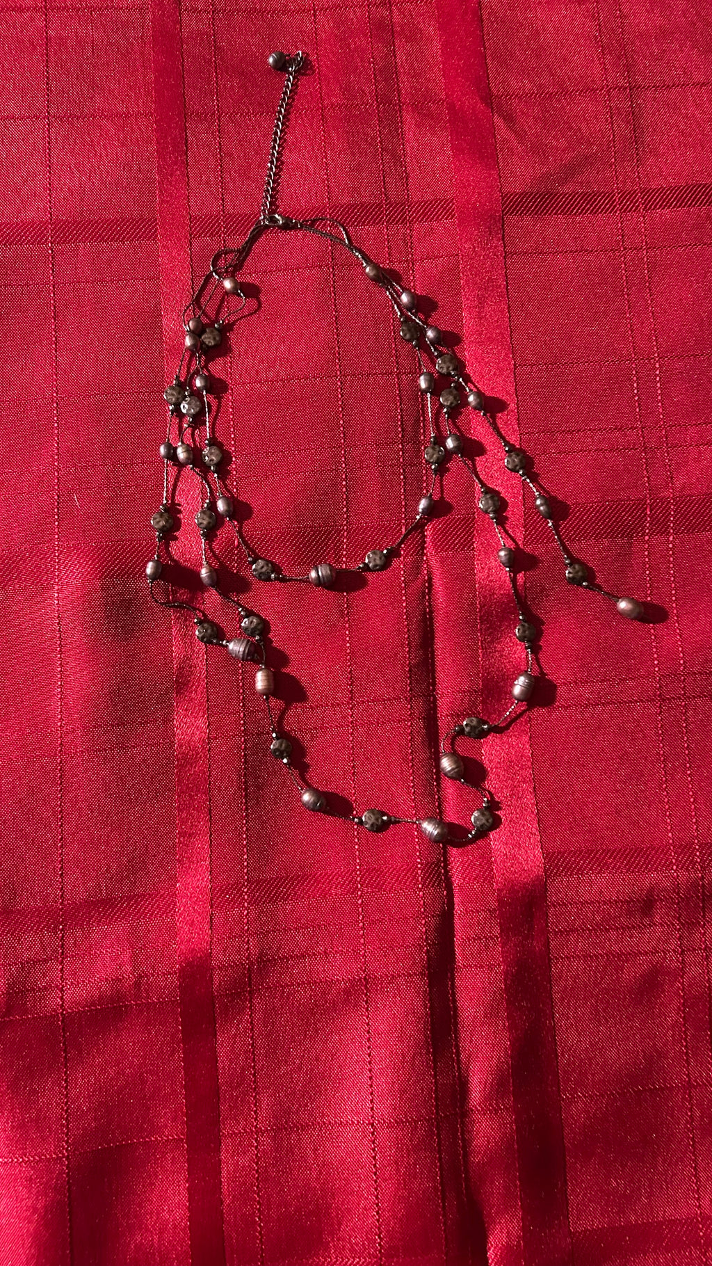 Long double-strand beaded necklace