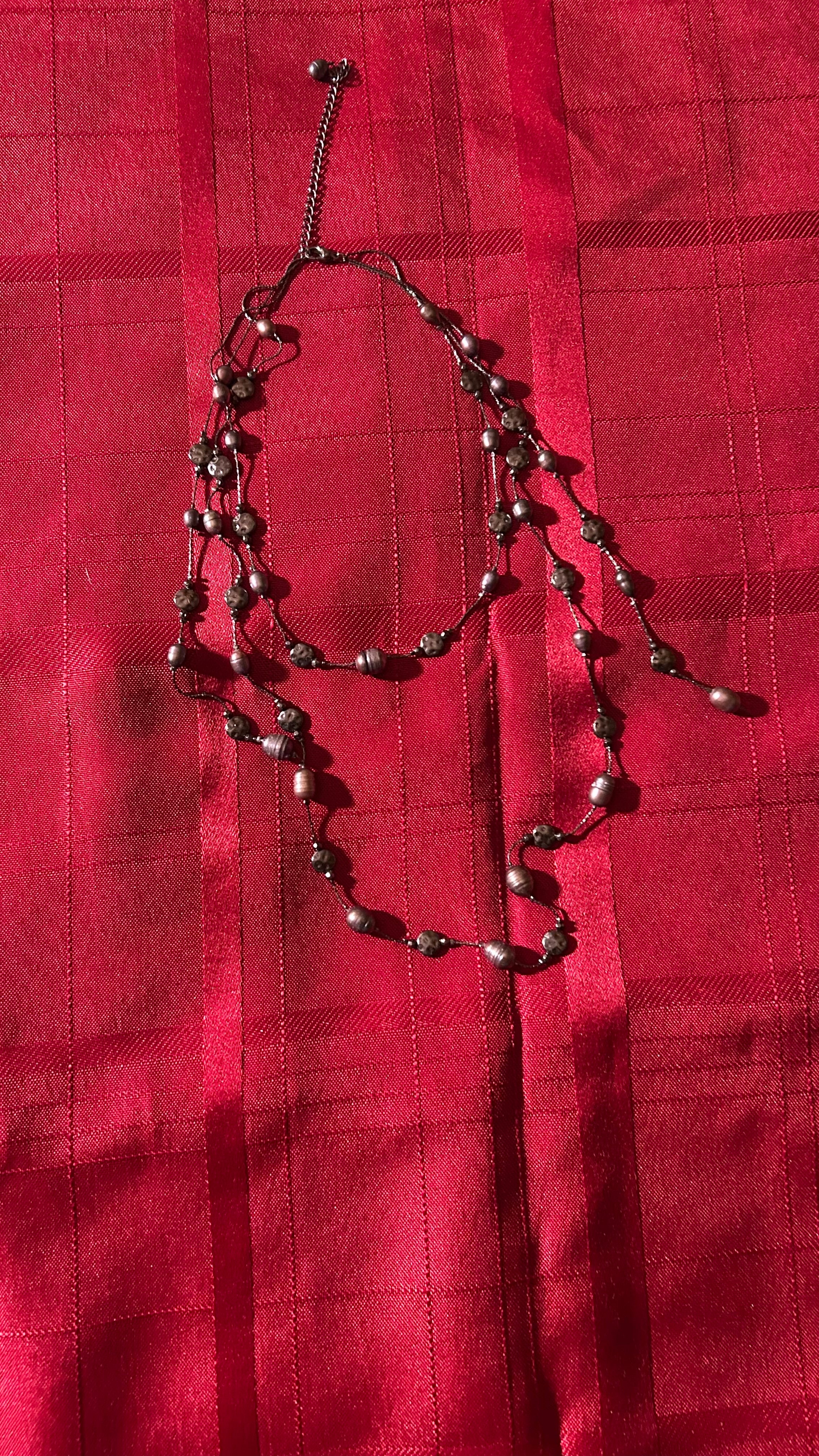 Long double-strand beaded necklace